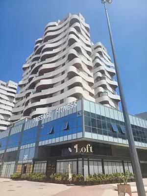 a tall building with a lot sign on it at Very beautiful apartment with see view 5th in Casablanca