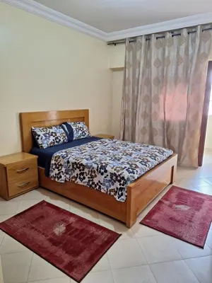a bedroom with a bed and a window with rugs at Home Sweet Home Just a 2-Minute Walk to the Tram