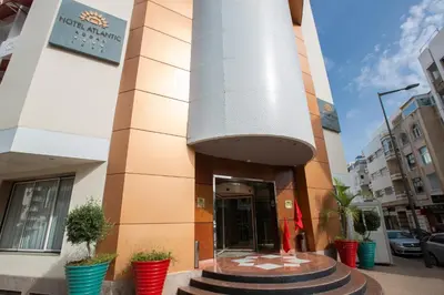 a building with a large column in front of it at Hotel Atlantic Agdal in Rabat