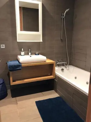 a bathroom with a sink and a bath tub at Luxury Anfaplace Living Resort in Casablanca