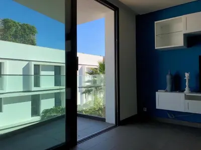 a room with a large glass door with a view at Luxury Anfaplace Living Resort in Casablanca