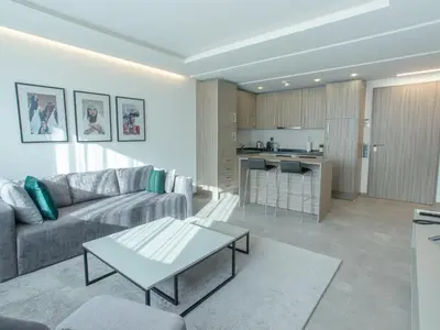 a living room with a couch and a table at Makass Appart Hotel in Rabat