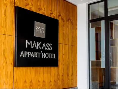 a sign on the wall of an apartment hotel at Makass Appart Hotel in Rabat