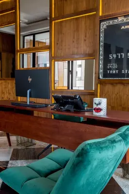 an office with a desk with a computer and a chair at Makass Appart Hotel in Rabat