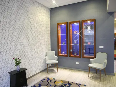 a room with two chairs and two windows at Gardenia Boutique Hotel in Rabat