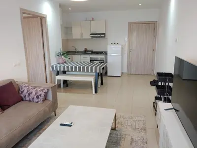 a living room with a couch and a kitchen at Atlantic studio in Atlantic Plaza with Free parking , Available public bus to,from casa port station and downtown in Casablanca