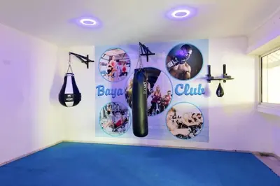 a room with posters on the wall of a gym at Sea view Tamaris Dar Bouazza in Tamaris
