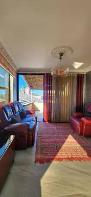 a living room with a couch and a rug at Equi Palace & SPA Near Aeroport in Berrechid