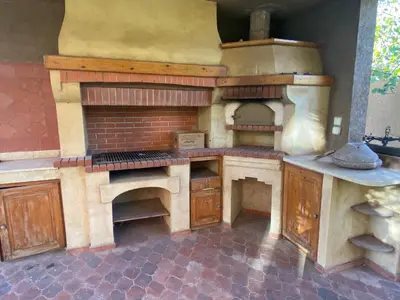 a large kitchen with a stove and an oven at Equi Palace & SPA Near Aeroport in Berrechid