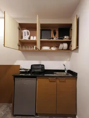 a kitchen with a sink and a dishwasher at Casa City Break Appart hôtel in Casablanca