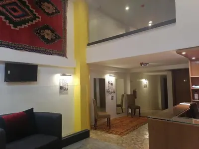 a lobby of a hotel with a couch and chairs at Casa City Break Appart hôtel in Casablanca
