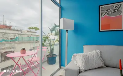 a living room with a couch and a table at Stayhere Rabat - Agdal 2 - Classic Residence in Rabat