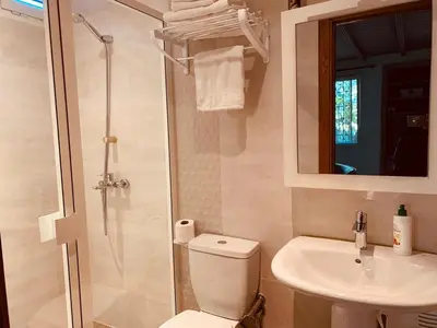 a bathroom with a toilet and a sink and a shower at Palmeraie skhirat 2 in Skhirat