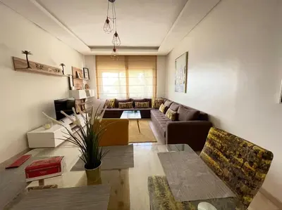 a living room with a couch and a table at 5 Star Apartment Near Airport in Nouaseur