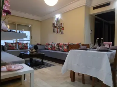 a living room with two tables and a couch at Apartment with Terrace in Casablanca