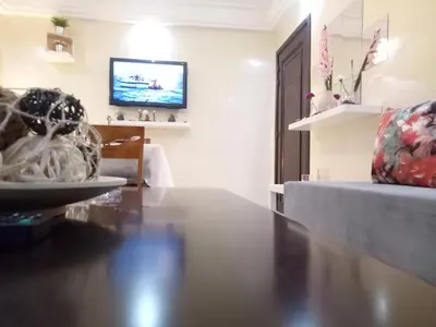 a living room with a table and a couch at Apartment with Terrace in Casablanca