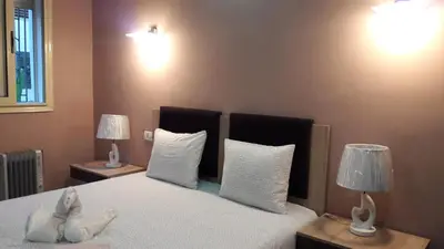 a bedroom with a bed with two lamps on two tables at Apartment with Terrace in Casablanca