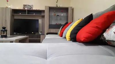 a living room with a couch with colorful pillows at Apartment with Terrace in Casablanca