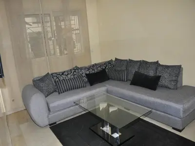 a living room with a couch and a glass table at Apartment with Terrace in Casablanca