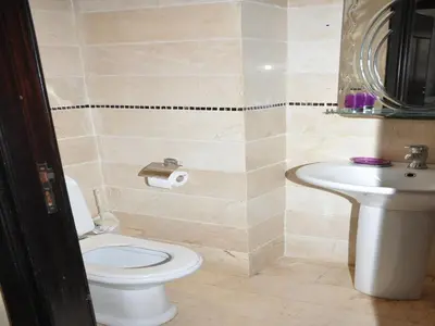a bathroom with a toilet and a sink at Apartment with Terrace in Casablanca