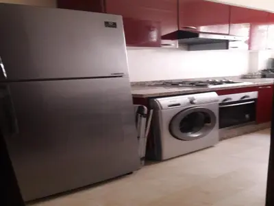 a kitchen with a refrigerator and a washing machine at Apartment with Terrace in Casablanca
