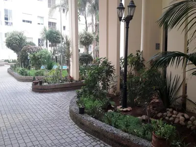 a courtyard with a bunch of plants and a street light at Apartment with Terrace in Casablanca