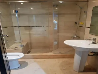 a bathroom with a shower and a toilet and a sink at Apartment with Terrace in Casablanca