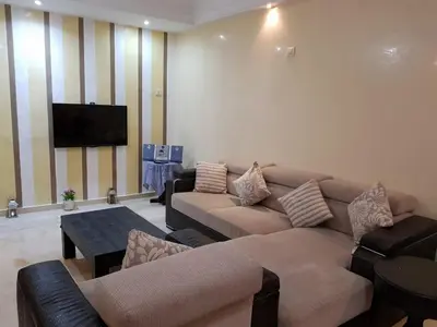a living room with couches and a flat screen tv at Apartment with Terrace in Casablanca