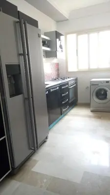 a kitchen with a refrigerator and a washer and dryer at Apartment with Terrace in Casablanca