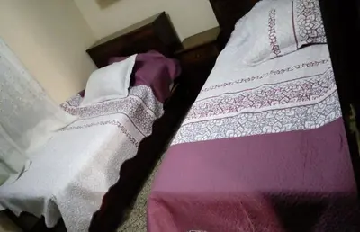 two beds sitting next to each other in a bedroom at Maison vintage Rabat Agdal in Rabat