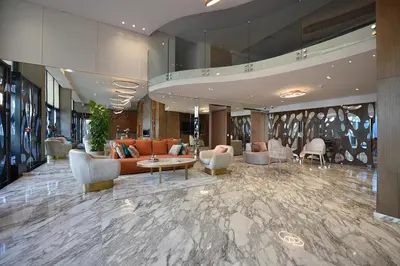 a lobby of a hotel with couches and chairs at Flower Town Hotel & Spa in Rabat