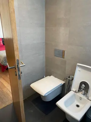 a bathroom with a toilet and a sink at Brand new, Stylish & Well located Apartment in Casa-Marina 12 in Casablanca