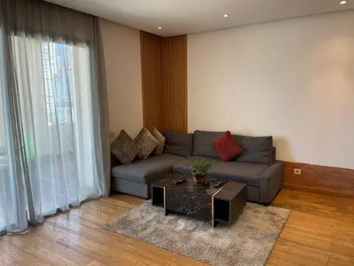 a living room with a couch and a table at Brand new, Stylish & Well located Apartment in Casa-Marina 12 in Casablanca