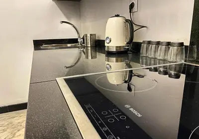 a glass counter top with a coffee maker on it at Amazing Flat in Gauthier - Breathtaking View - Best Location in Casablanca