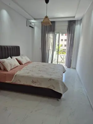 a bedroom with a large bed and a large window at My Cosy Place Rabat - RABAT AGDAL GARE TGV ARRIBAT Center in Rabat