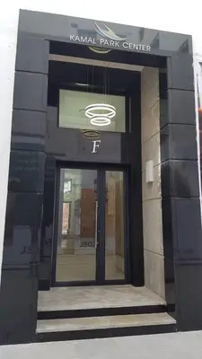 a front door of a building with a sign on it at Du Haut Standing au coeur du Parc et Plage à 180 m in Mohammedia