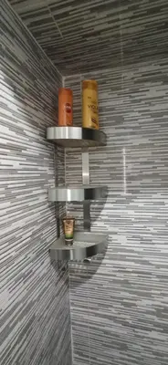two shelves on the wall with candles on them at Maison de la famille in Casablanca