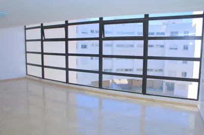 an empty room with a large window in a building at Bouznika 22 in Bouznika