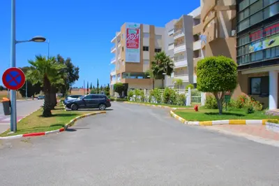 a car driving down a street in a building at Bouznika 22 in Bouznika