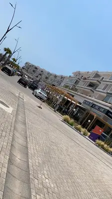 an empty street in front of a large building at Mansbay Beach, Vue sur Mer, accès Plage à pied, Mohammedia in Mohammedia