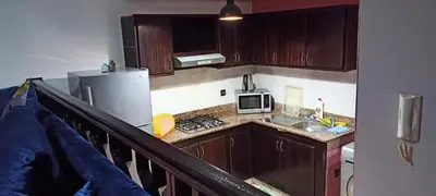 a small kitchen with a sink and a microwave at Studio meublé Casablanca in Casablanca