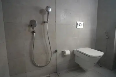 a shower in a bathroom with a toilet at Maarif Home Casablanca in Casablanca
