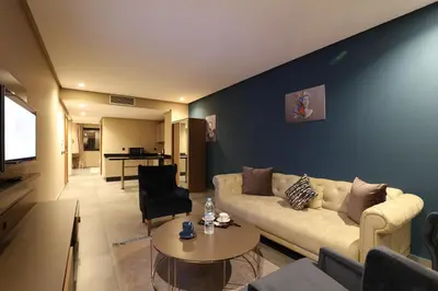 a living room with a couch and a table at Address Hotel Casablanca in Casablanca