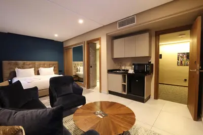 a hotel room with a bed and a table at Address Hotel Casablanca in Casablanca