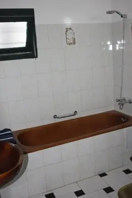 a bath tub in a bathroom with a window at La Grande Proprit toile De Mer in Skhirat