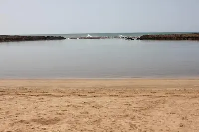 a beach with a body of water in the background at Maison Etoile De Mer 1 in Skhirat