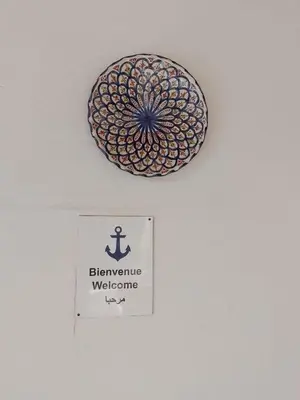 a sign on a wall with a sign on a ceiling with a sign at Maison Etoile De Mer 1 in Skhirat