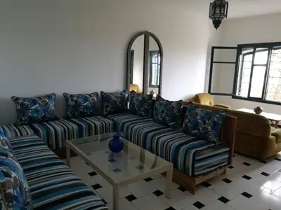 a living room with a couch and a table at Maison Etoile De Mer 2 in Skhirat