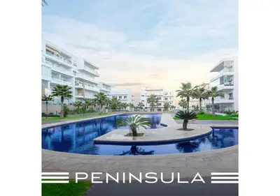 an image of a swimming pool in front of some apartment buildings at Peninsula Dar Bouazza Superbe appartement en résidence avec piscine activités in Dar Bouazza