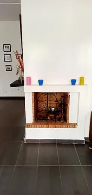 a fireplace with three bowls on top of it at Appartement Familial avec Jardin, Résidence avec Piscine Dar El Bahr in Sidi Rahal
